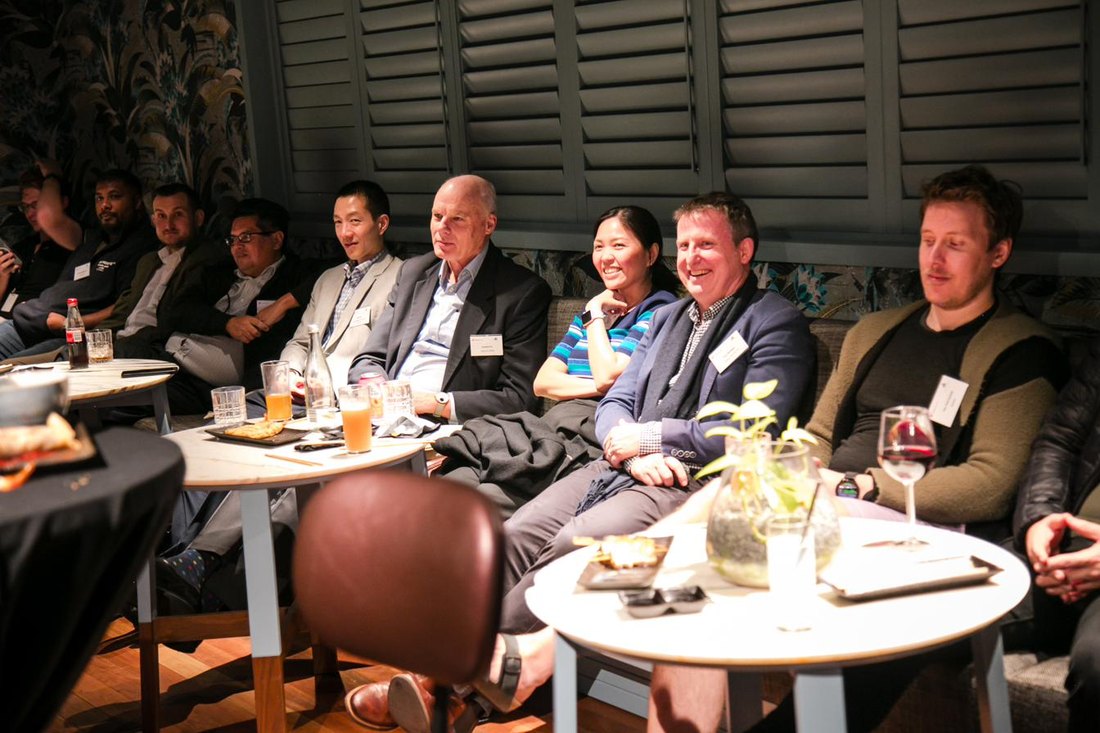 Guests in conversation at an Innovatus Media dinner